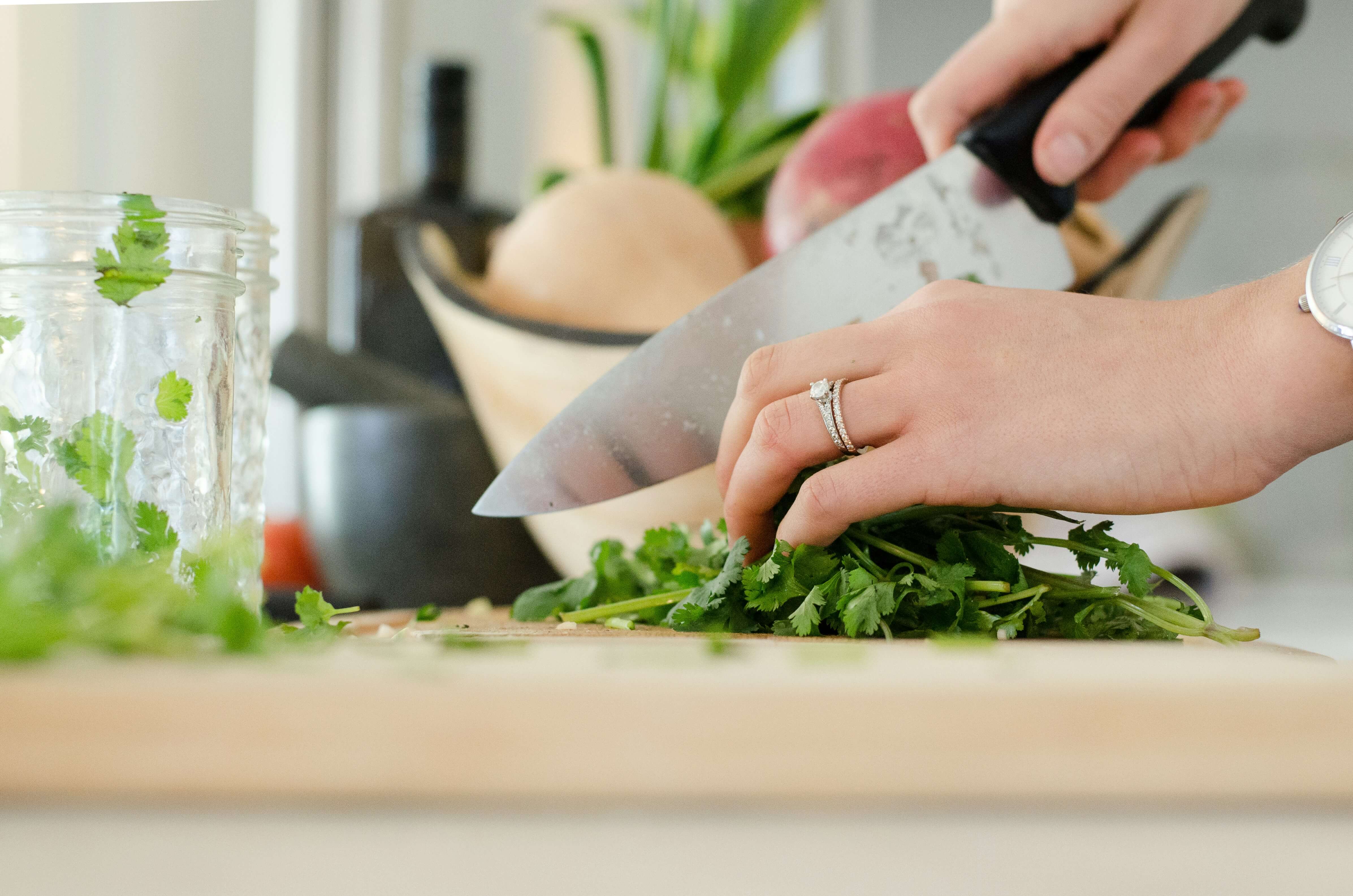 A beautifully plated dish being basted in a cast iron pan